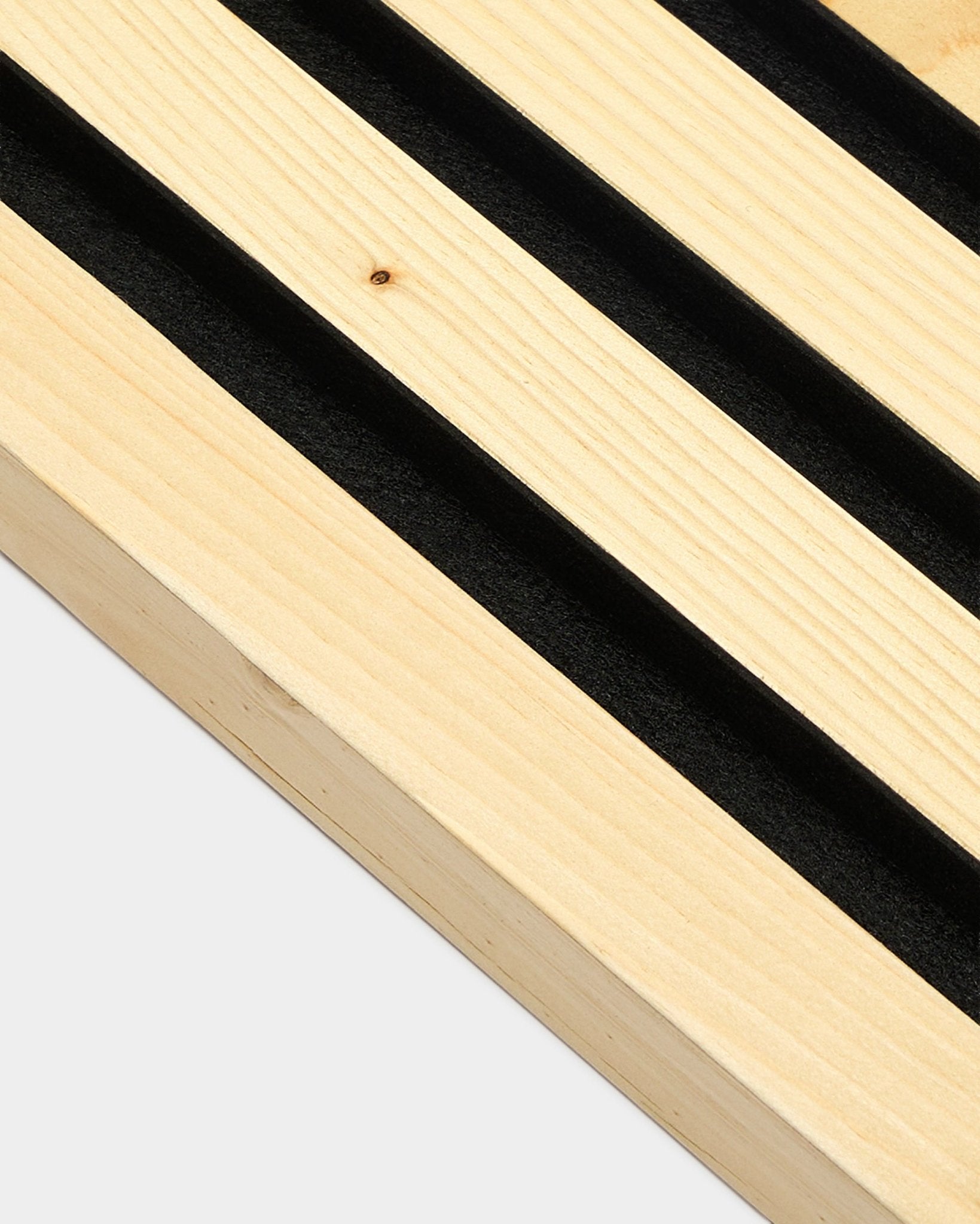 WoodUpp Alp acoustic panel (2.2 cm) with parallel black felt grooves and MDF frame, displayed against a plain white background. Nordic minimalist design.